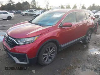 2020 Honda CR-V Touring with VIN 2HKRW2H96LH659793, listed as a IAAI auction lot 41145758 with 113,344 mi miles and . Bid and sale history available at DreamBid. Image 2.