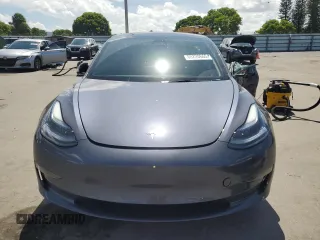 2023 Tesla Model 3 with VIN 5YJ3E1EA8PF704349, listed as a Copart auction lot 60220665 with 18,873 mi miles and Non repairable. Bid and sale history available at DreamBid. Image 5.