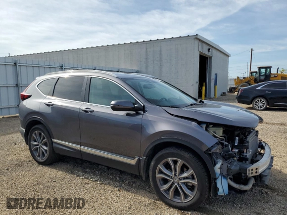 2020 Honda CR-V Touring with VIN 2HKRW2H99LH677964, listed as a Copart auction lot 61169915 with 65,915 mi miles and Salvage title. Bid and sale history available at DreamBid. Image 4.