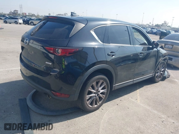 2019 Mazda CX-5 Grand Touring with VIN JM3KFADMXK1547727, listed as a IAAI auction lot 42138071 with Not provided miles and . Bid and sale history available at DreamBid. Image 4.