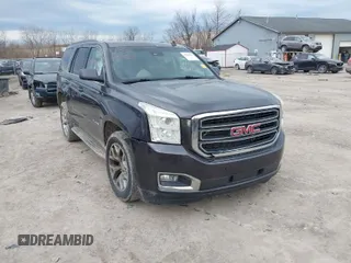 2015 GMC Yukon SLT with VIN 1GKS2BKC3FR113911, listed as a IAAI auction lot 41886403 with 200,090 mi miles. Bid and sale history available at carsss.com. Image 1.