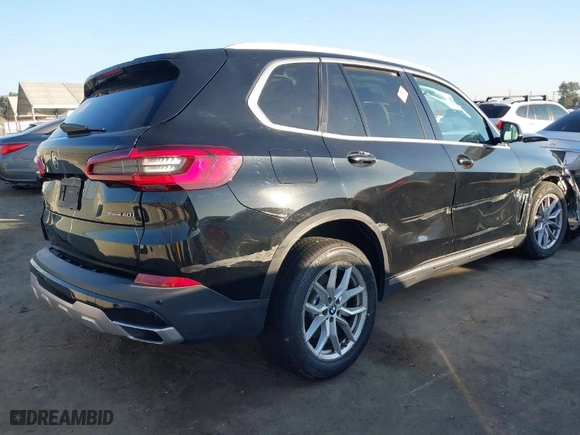 2020 BMW X5 sDrive40i with VIN 5UXCR4C0XLLW65026, listed as a IAAI auction lot 41048999 with 70,052 mi miles. Bid and sale history available at carsss.com. Image 4.