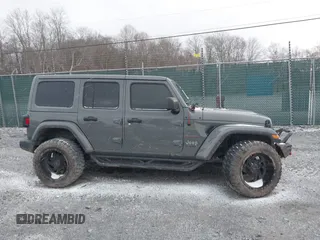 2019 Jeep Wrangler Unlimited Sahara with VIN 1C4HJXEG8KW533339, listed as a IAAI auction lot 40963653 with 69,202 mi miles and . Bid and sale history available at DreamBid. Image 13.