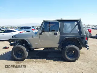 2005 Jeep Wrangler Sport with VIN 1J4FA49S65P342497, listed as a IAAI auction lot 41674606 with 123,457 mi miles. Bid and sale history available at carsss.com. Image 14.