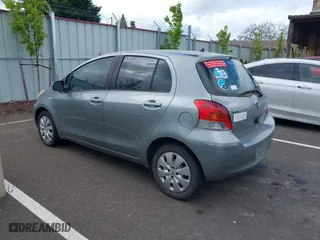 2009 Toyota Yaris with VIN JTDKT903295237216, listed as a IAAI auction lot 42087676 with 158,341 mi miles. Bid and sale history available at carsss.com. Image 3.