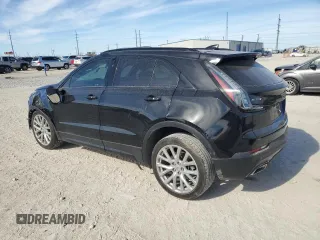 2023 Cadillac XT4 FWD Sport with VIN 1GYFZER47PF107311, listed as a Copart auction lot 87583565 with 26,585 mi miles and Salvage title. Bid and sale history available at DreamBid. Image 2.