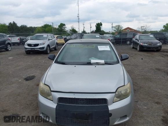 2005 Scion tC with VIN JTKDE177050032815, listed as a IAAI auction lot 42123702 with 228,973 mi miles. Bid and sale history available at carsss.com. Image 6.