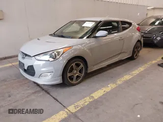 2013 Hyundai Veloster w/Black Int with VIN KMHTC6AD2DU128534, listed as a IAAI auction lot 41791398 with 158,414 mi miles and . Bid and sale history available at DreamBid. Image 2.