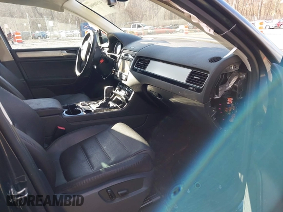 2016 Volkswagen Touareg Sport with VIN WVGEF9BP2GD005315, listed as a IAAI auction lot 41588590 with 134,709 mi miles and . Bid and sale history available at DreamBid. Image 5.