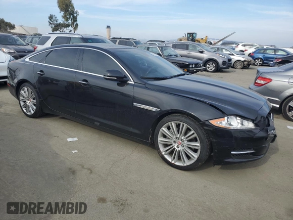 2015 Jaguar XJ with VIN SAJWA2GZ4F8V86379, listed as a Copart auction lot 42624615 with 55,803 mi miles and Salvage Title. Bid and sale history available at carsss.com. Image 4.