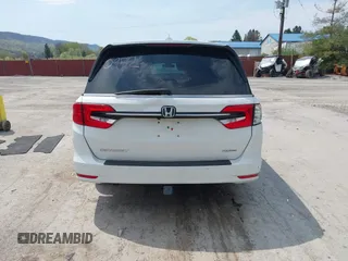2021 Honda Odyssey Touring with VIN 5FNRL6H80MB010952, listed as a IAAI auction lot 42080412 with 90,594 mi miles and . Bid and sale history available at DreamBid. Image 16.