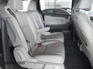 2019 Honda Odyssey Touring z VIN 5FNRL6H88KB037149, wystawiony jako IAAI lot #42356871 z przebiegiem 64 549 mil mil oraz . Historia ofert i sprzedaży dostępna na DreamBid. Obrazek 8.