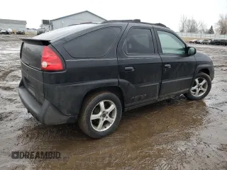 2003 Pontiac Aztek z VIN 3G7DB03E83S580211, wystawiony jako Copart lot #47303045 z przebiegiem Nie podano mil oraz Czysty tytuł • Clean title. Historia ofert i sprzedaży dostępna na DreamBid. Obrazek 3.