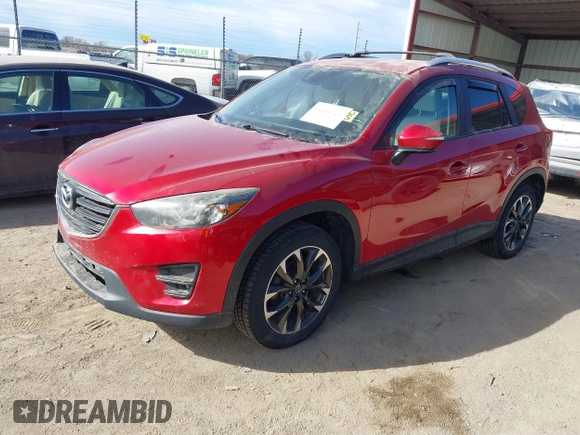 2016 Mazda CX-5 Grand Touring with VIN JM3KE4DY0G0709563, listed as a IAAI auction lot 41886956 with 156,769 mi miles. Bid and sale history available at carsss.com. Image 18.
