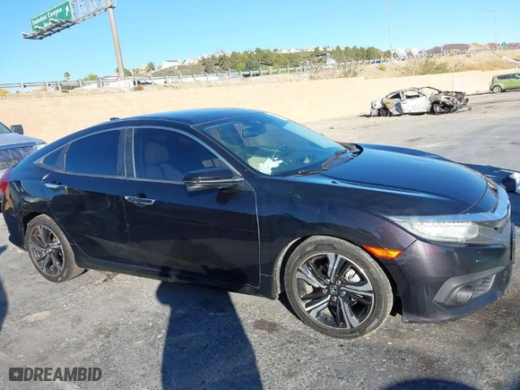 2016 Honda Civic Sedan Touring with VIN 19XFC1F99GE206092, listed as a IAAI auction lot 41031121 with 133,682 mi miles. Bid and sale history available at carsss.com. Image 13.