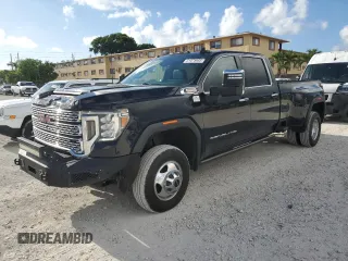 2023 GMC Sierra 3500HD Denali z VIN 1GT49WEY5PF143445, wystawiony jako Copart lot #61078965 z przebiegiem 29 158 mil mil oraz Czysty tytuł • Clean title. Historia ofert i sprzedaży dostępna na DreamBid. Obrazek 1.