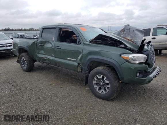 2021 Toyota Tacoma 4WD SR5 with VIN 3TMDZ5BNXMM099474, listed as a Copart auction lot 49325385 with 57,853 mi miles and Salvage Title. Bid and sale history available at carsss.com. Image 4.