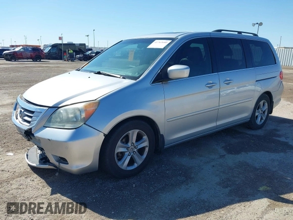 2010 Honda Odyssey Touring with VIN 5FNRL3H97AB015472, listed as a IAAI auction lot 41763680 with 144,309 mi miles. Bid and sale history available at carsss.com. Image 2.