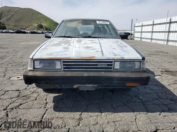 1986 Toyota Camry z VIN JT2SV16E6G0520922, wystawiony jako Copart lot #47146675 z przebiegiem 156 394 mil mil oraz Szkoda całkowita • Salvage title. Historia ofert i sprzedaży dostępna na DreamBid. Obrazek 5.