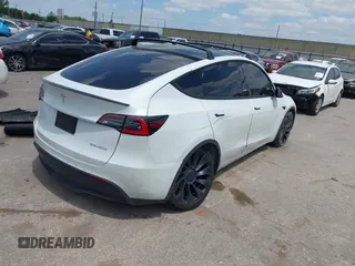 2021 Tesla Model Y Performance with VIN 5YJYGDEF9MF081798, listed as a IAAI auction lot 42033358 with 64,679 mi miles and . Bid and sale history available at DreamBid. Image 4.
