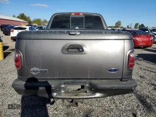 2002 Ford F-150 Harley Davidson with VIN 1FTRW07362KC77880, listed as a Copart auction lot 75259594 with 103,591 mi miles and Salvage Title. Bid and sale history available at carsss.com. Image 6.