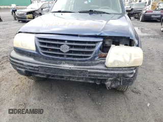 2004 Suzuki Vitara z VIN 2S3TD62VX46100019, wystawiony jako Copart lot #74291684 z przebiegiem 148 566 mil mil oraz Szkody całkowita. Historia ofert i sprzedaży dostępna na DreamBid. Obrazek 13.