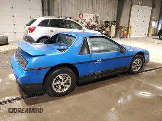 1987 Pontiac Fiero z VIN 1G2PF11R6HP237261, wystawiony jako Copart lot #85061534 z przebiegiem Nie podano mil oraz Czysty tytuł • Clean title. Historia ofert i sprzedaży dostępna na DreamBid. Obrazek 3.