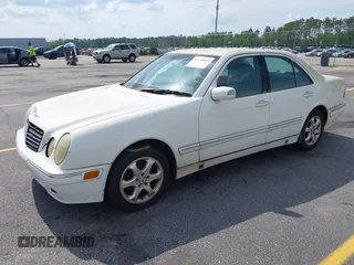 2002 Mercedes-Benz E-Class with VIN WDBJF65J22B432263, listed as a IAAI auction lot 42130545 with 220,852 mi miles. Bid and sale history available at carsss.com. Image 2.