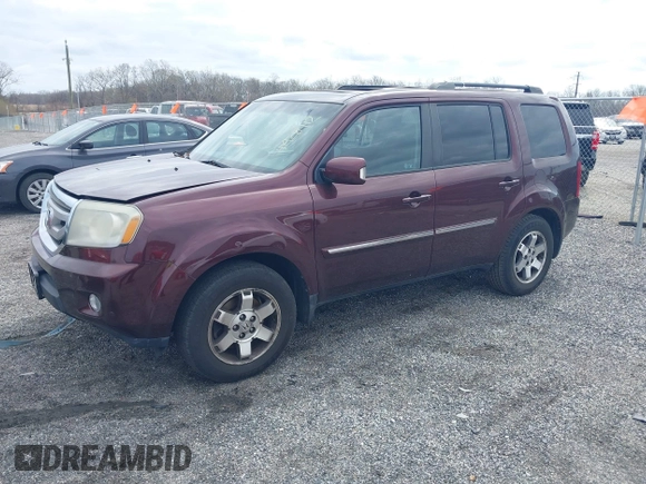 2010 Honda Pilot Touring with VIN 5FNYF4H95AB040721, listed as a IAAI auction lot 41928412 with 213,219 mi miles and . Bid and sale history available at carsss.com. Image 17.