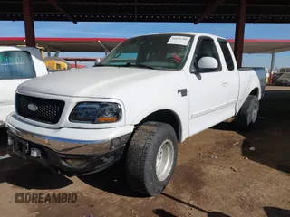 1999 Ford F-150 XL with VIN 2FTRX18L9XCA21004, listed as a IAAI auction lot 41616300 with 186,620 mi miles. Bid and sale history available at carsss.com. Image 17.