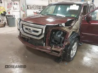 2011 Honda Pilot EX-L with VIN 5FNYF4H56BB051404, listed as a IAAI auction lot 41758332 with 301,099 mi miles. Bid and sale history available at carsss.com. Image 6.