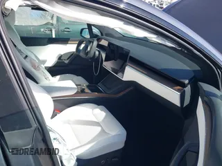2023 Tesla Model X with VIN 7SAXCBE50PF378548, listed as a IAAI auction lot 41698357 with Not Provided miles and . Bid and sale history available at DreamBid. Image 5.