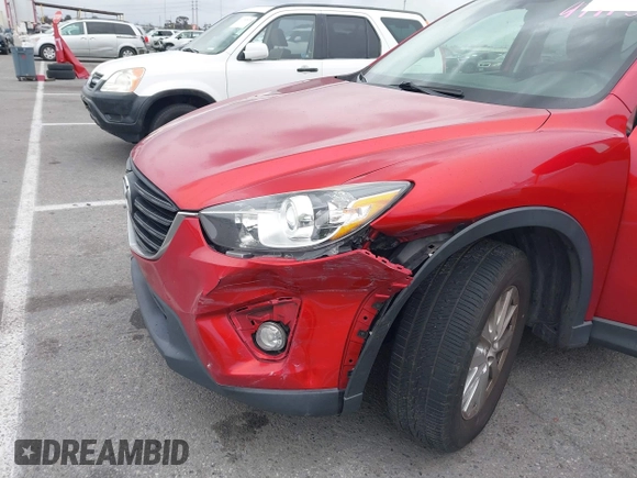 2016 Mazda CX-5 Touring with VIN JM3KE2CY3G0877185, listed as a IAAI auction lot 41729243 with 144,656 mi miles. Bid and sale history available at carsss.com. Image 6.