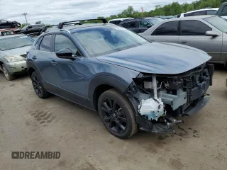 2022 Mazda CX-30 S Carbon Edition with VIN 3MVDMBCL7NM408036, listed as a Copart auction lot 56683665 with 82,337 mi miles and Salvage title. Bid and sale history available at DreamBid. Image 4.