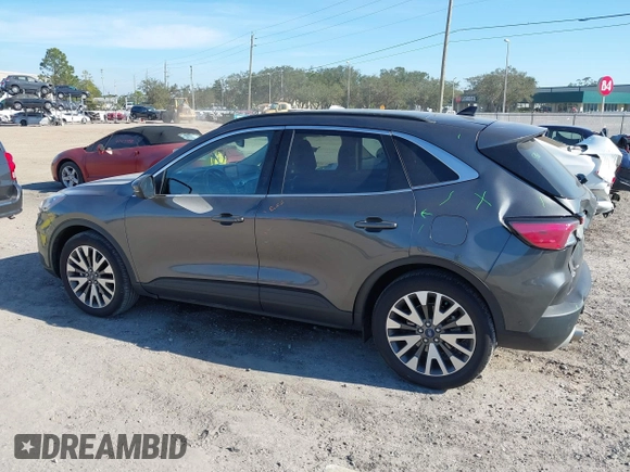 2020 Ford Escape Titanium with VIN 1FMCU9J9XLUA66440, listed as a IAAI auction lot 41464049 with 57,626 mi miles and . Bid and sale history available at DreamBid. Image 14.