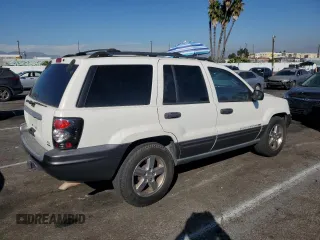 2004 Jeep Grand Cherokee with VIN 1J4GX48JX4C301369, listed as a Copart auction lot 77803094 with 179,404 mi miles and Clean title. Bid and sale history available at DreamBid. Image 3.