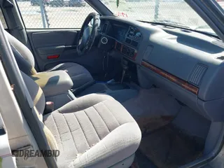 1996 Jeep Grand Cherokee Laredo with VIN 1J4FX58S2TC397006, listed as a IAAI auction lot 41836108 with 136,742 mi miles. Bid and sale history available at carsss.com. Image 5.