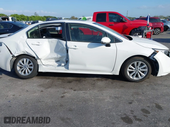 2024 Toyota Corolla Hybrid LE with VIN JTDBCMFE2RJ031865, listed as a IAAI auction lot 41602715 with 10,892 mi miles. Bid and sale history available at carsss.com. Image 6.