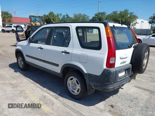 2002 Honda CR-V LX with VIN JHLRD684X2C010447, listed as a IAAI auction lot 42166268 with 233,336 mi miles and . Bid and sale history available at carsss.com. Image 3.