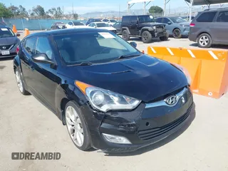 2013 Hyundai Veloster w/Black Int with VIN KMHTC6AD4DU132701, listed as a IAAI auction lot 42021759 with 102,840 mi miles and . Bid and sale history available at DreamBid. Image 1.