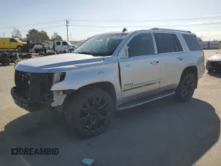 2015 Chevrolet Tahoe LTZ with VIN 1GNSKCKC2FR202801, listed as a Copart auction lot 55958125 with 104,705 mi miles and Salvage title. Bid and sale history available at DreamBid. Image 1.