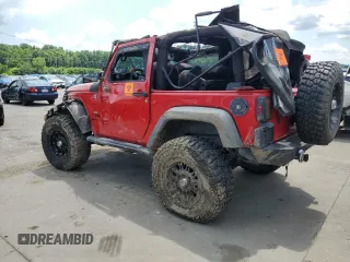 2014 Jeep Wrangler Sport with VIN 1C4AJWAG4EL205584, listed as a Copart auction lot 63671245 with Not provided miles and Salvage title. Bid and sale history available at DreamBid. Image 2.