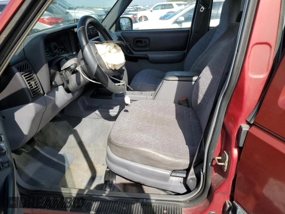 1998 Jeep Cherokee Sport with VIN 1J4FT68S4WL270134, listed as a Copart auction lot 51019695 with 246,945 mi miles and Non Repairable. Bid and sale history available at carsss.com. Image 7.