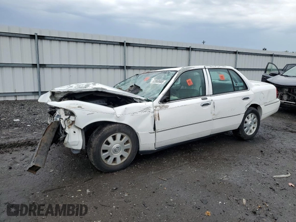 2003 Mercury Grand Marquis LS Premium with VIN 2MEFM75W13X667779, listed as a Copart auction lot 52869985 with 127,506 mi miles and Salvage Title. Bid and sale history available at DreamBid. Image 1.