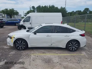 2023 Honda Civic EX-L with VIN 19XFL1H70PE014510, listed as a IAAI auction lot 42395890 with 14,163 mi miles and . Bid and sale history available at DreamBid. Image 14.