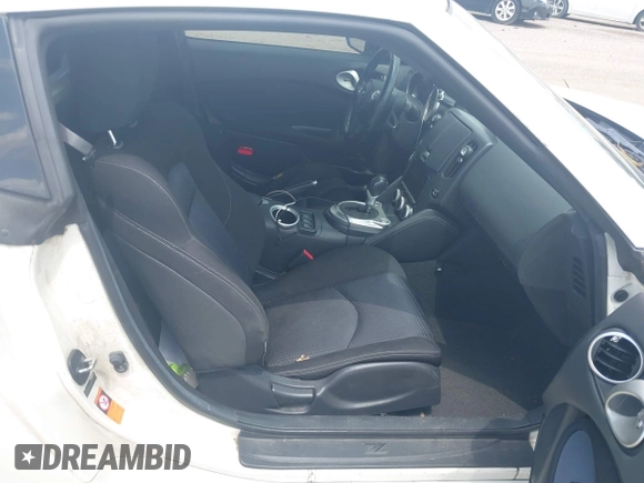 2012 Nissan 370Z z VIN JN1AZ4EH5CM564517, wystawiony jako IAAI lot #42385869 z przebiegiem 55 359 mil mil oraz . Historia ofert i sprzedaży dostępna na DreamBid. Obrazek 5.