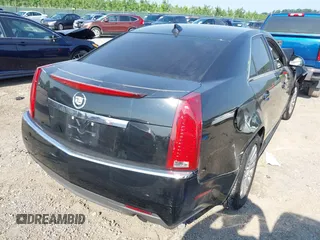 2010 Cadillac CTS with VIN 1G6DA5EG7A0140388, listed as a IAAI auction lot 42451088 with 123,128 mi miles and . Bid and sale history available at DreamBid. Image 4.