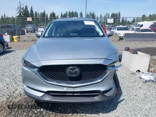 2018 Mazda CX-5 Grand Touring z VIN JM3KFADM7J0318684, wystawiony jako IAAI lot #42226937 z przebiegiem 69 166 mil mil oraz . Historia ofert i sprzedaży dostępna na DreamBid. Obrazek 12.