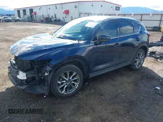 2019 Mazda CX-5 Signature with VIN JM3KFBEY5K0609063, listed as a IAAI auction lot 41802772 with 104,112 mi miles. Bid and sale history available at carsss.com. Image 2.