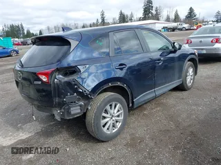 2015 Mazda CX-5 Touring with VIN JM3KE4CY5F0453646, listed as a IAAI auction lot 41740574 with 91,167 mi miles. Bid and sale history available at carsss.com. Image 4.